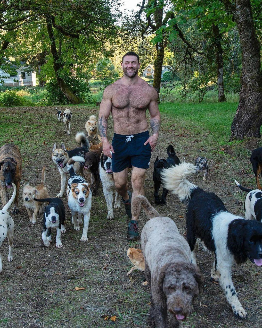 Lee Asher with a pack of his rescued dogs